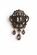 Vintage-Inspired Ornate Brooch with Smoky Crystals